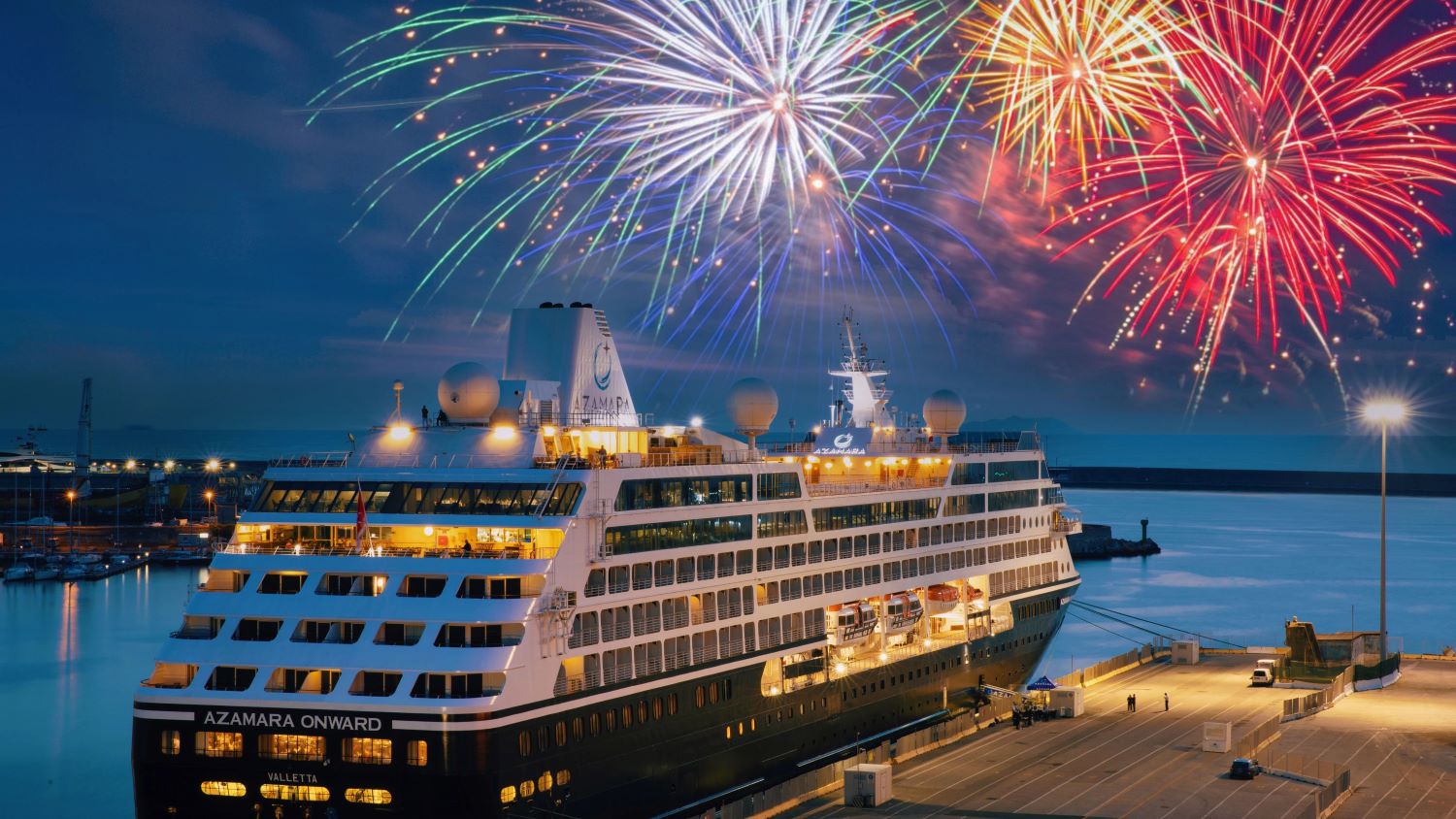 docked cruise ship with fireworks